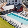 Resort-style swimming pool with lounge seating