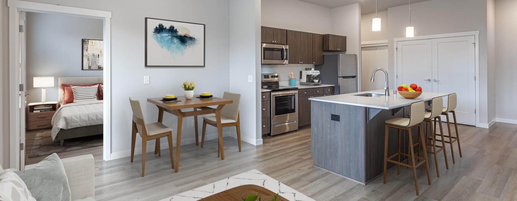 a kitchen with a dining table and couches